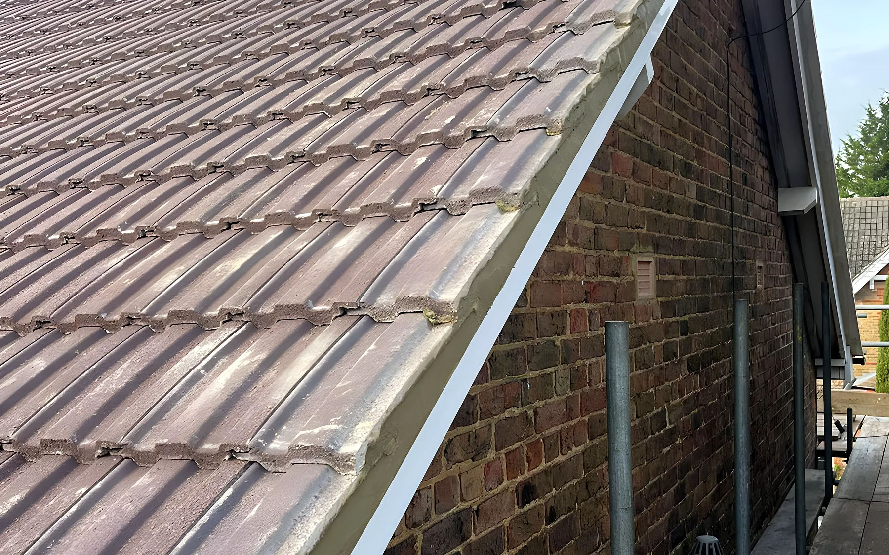 New tiles and a clean verge seen from the gable