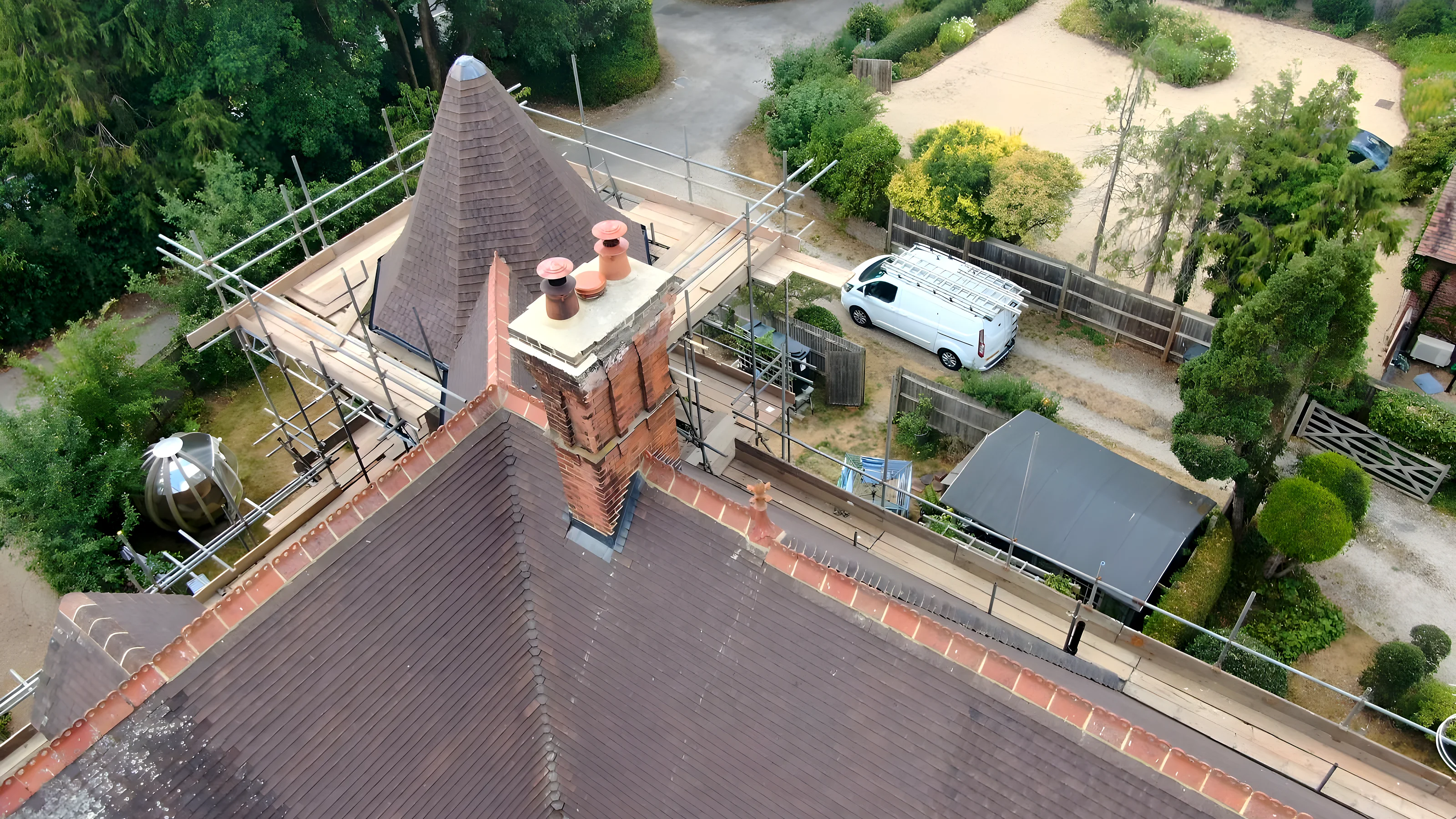 White bungalow with a new tiled roof, a finished job