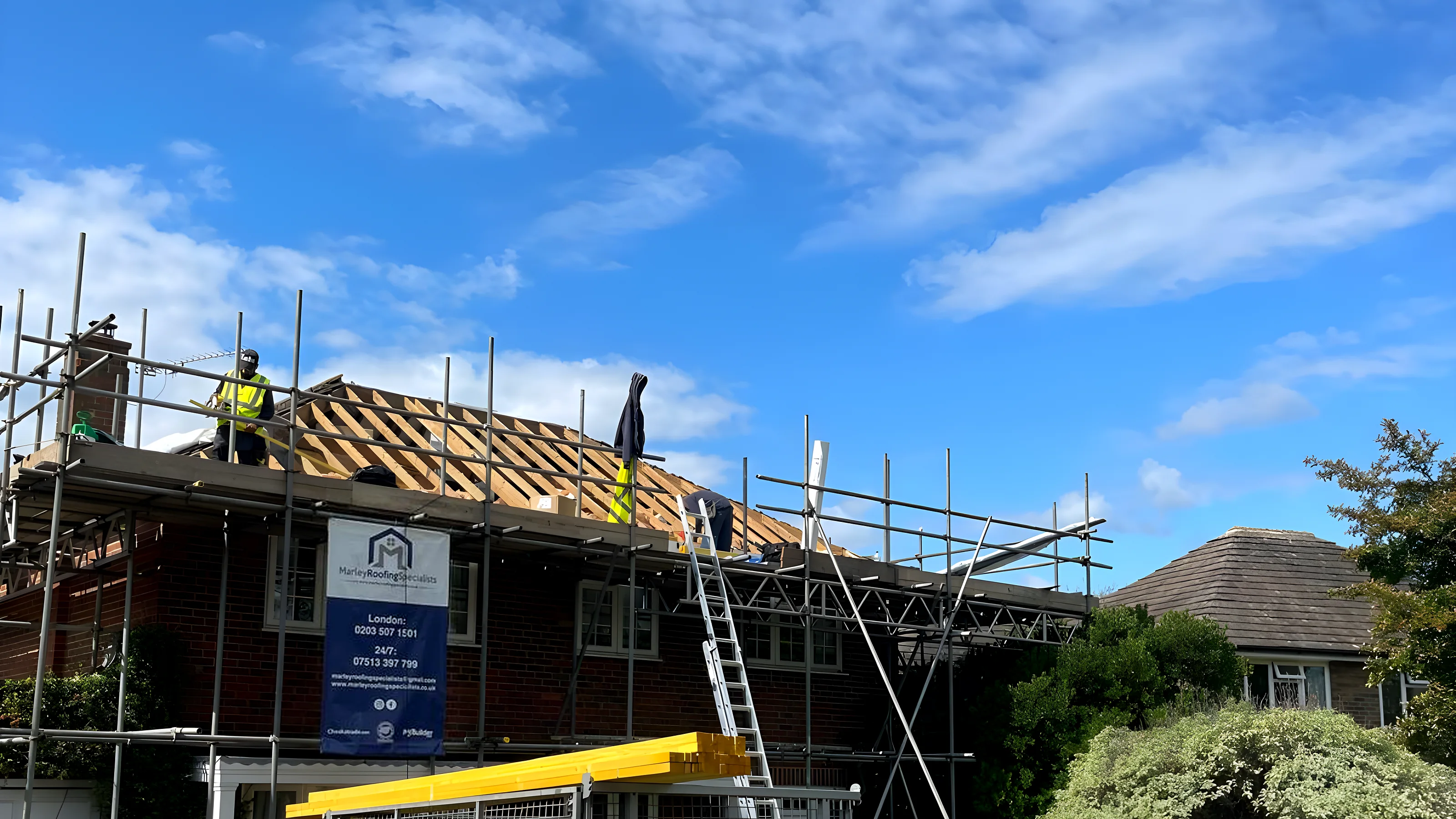 House with the scaffold up and the roof stripped back during an urgent repair