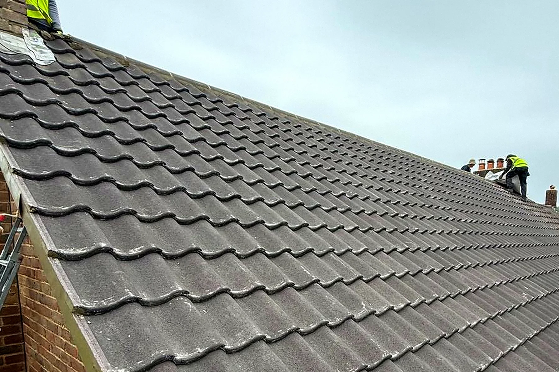 The same roof from the same place on the scaffold, finished in new interlocking tiles