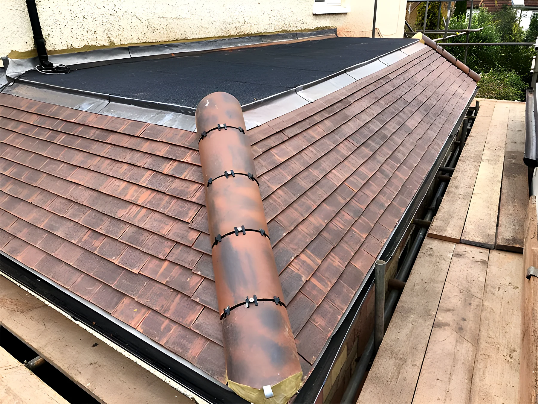 Ridge tiles being laid on a new roof