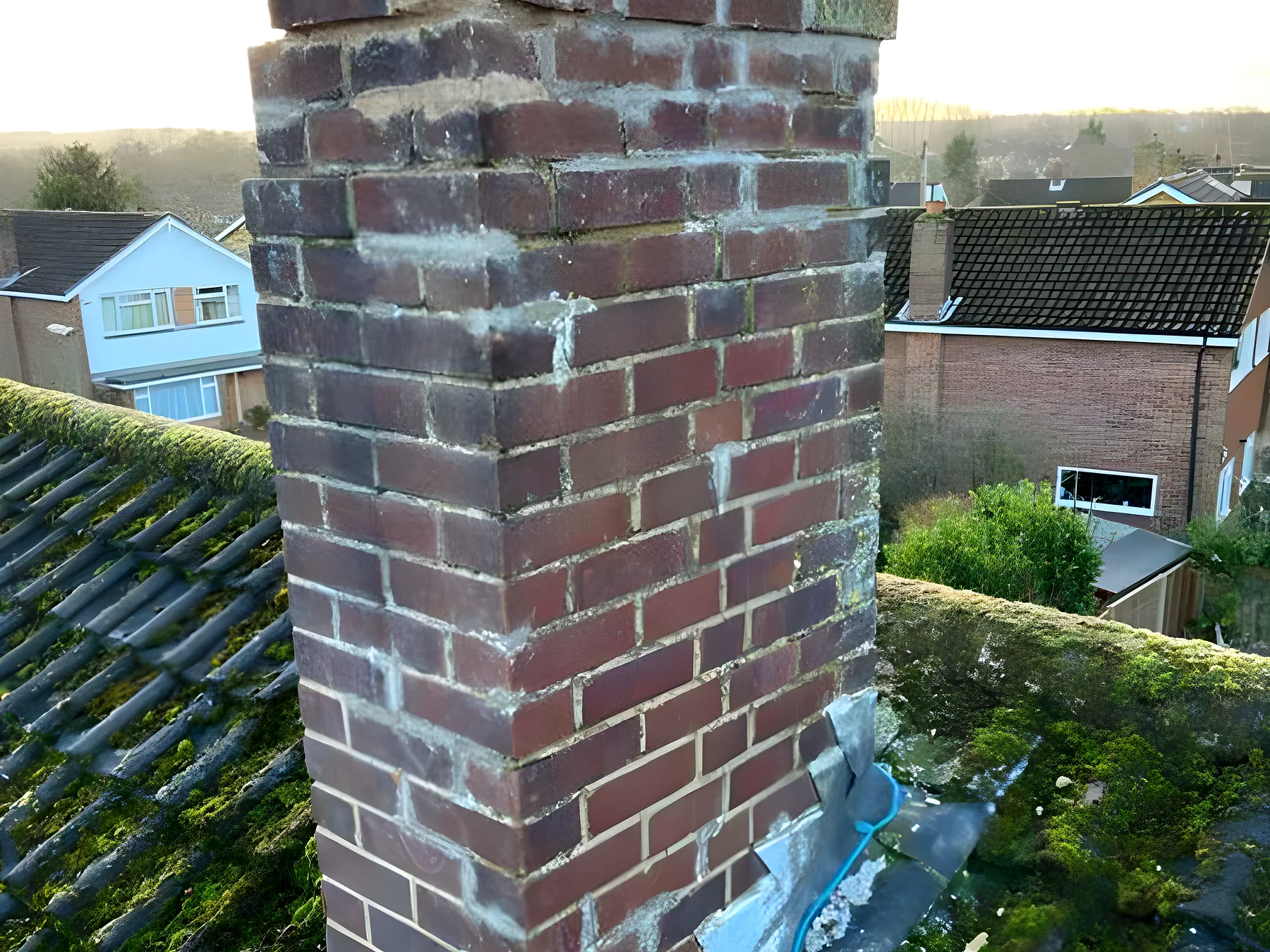 An old brick chimney before repointing