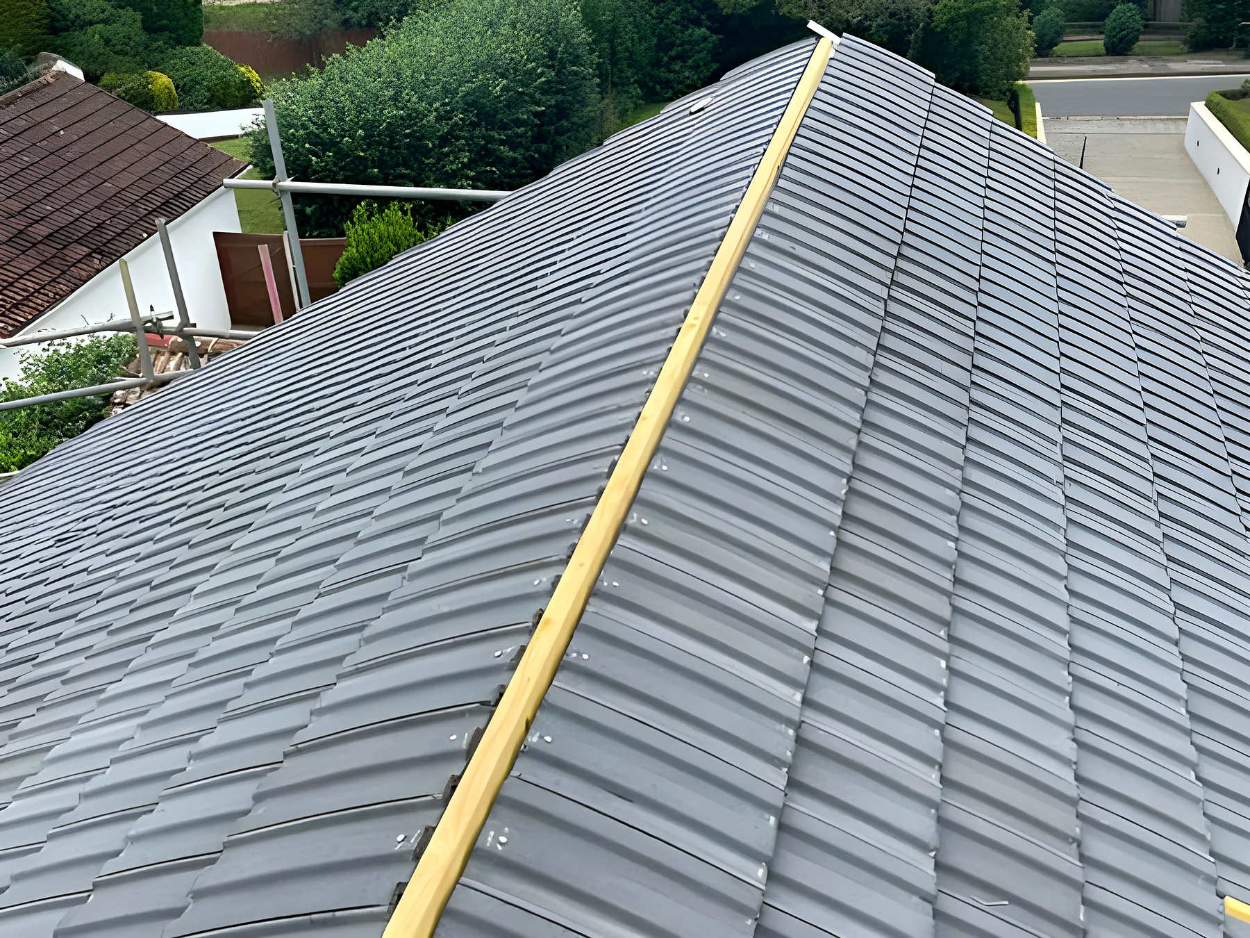 A finished slate roof with a new ridge