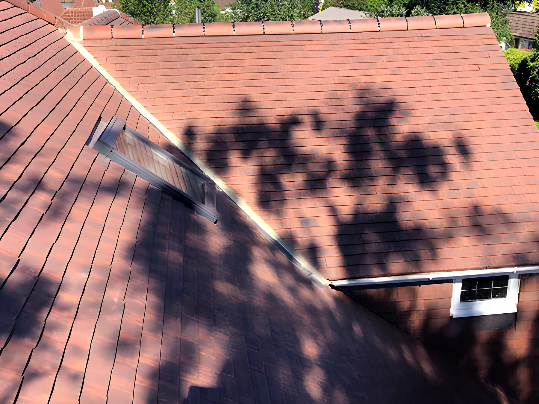 A red tiled roof with a dormer