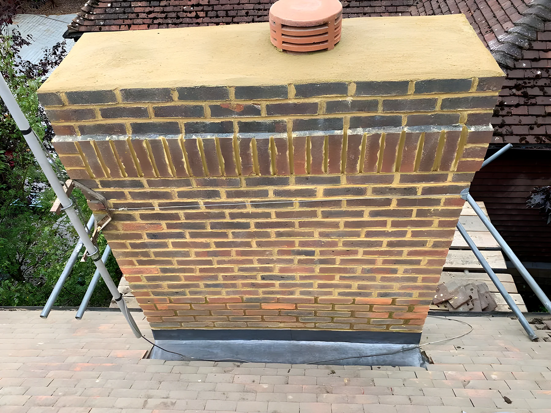 A rebuilt chimney with new pots and flaunching
