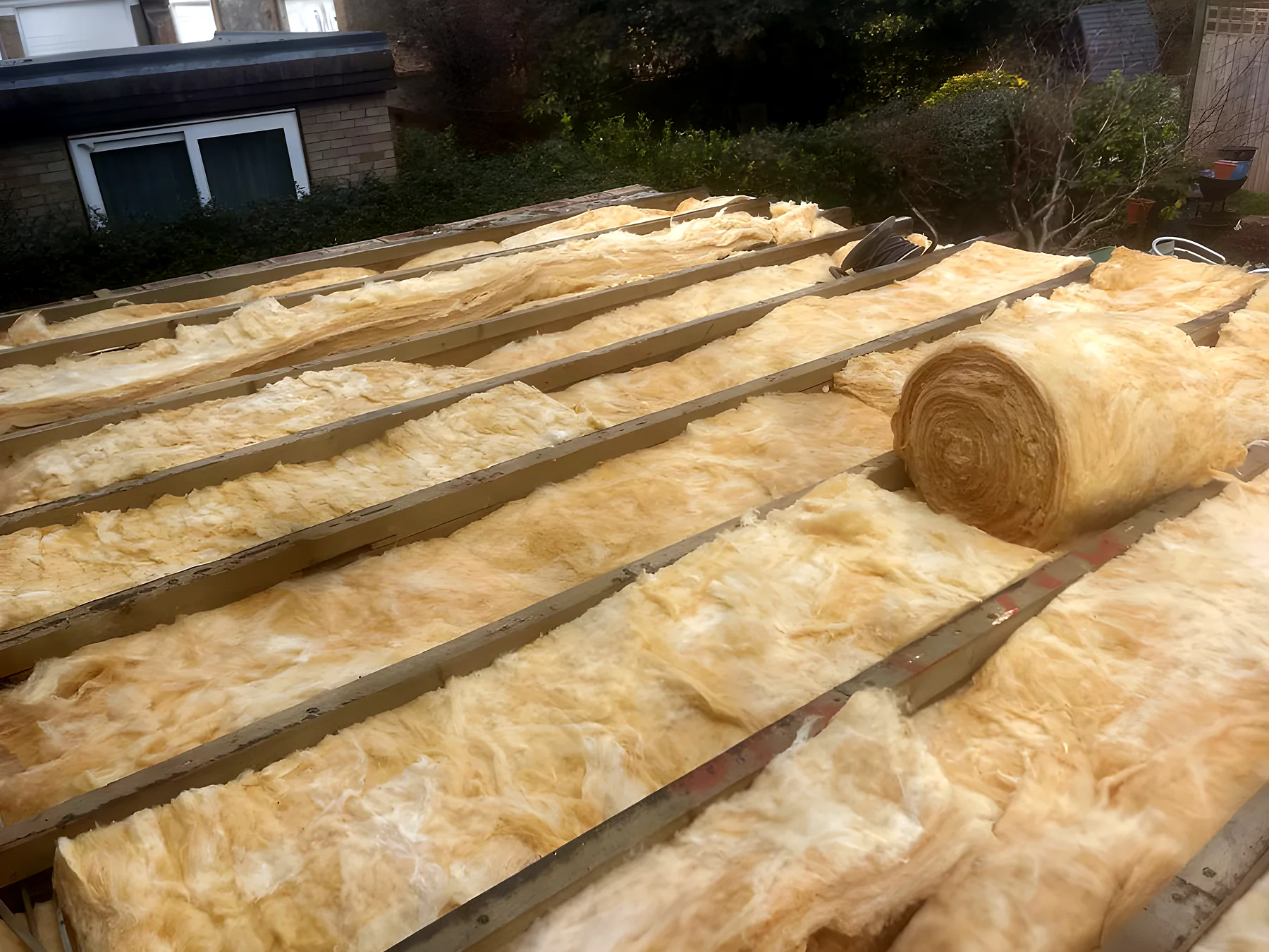 Insulation fitted between the joists of a flat roof