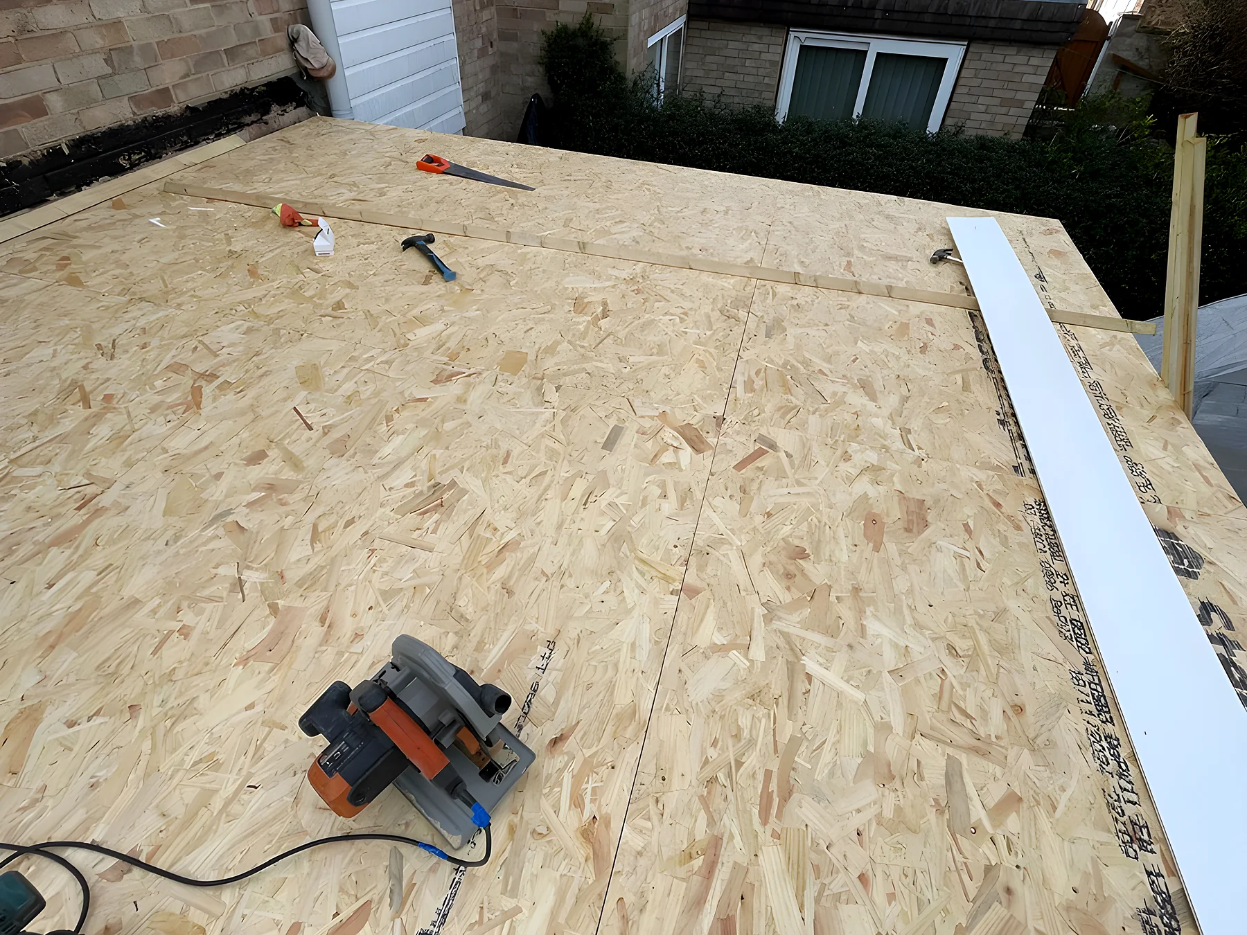 A new OSB deck laid and ready for its covering