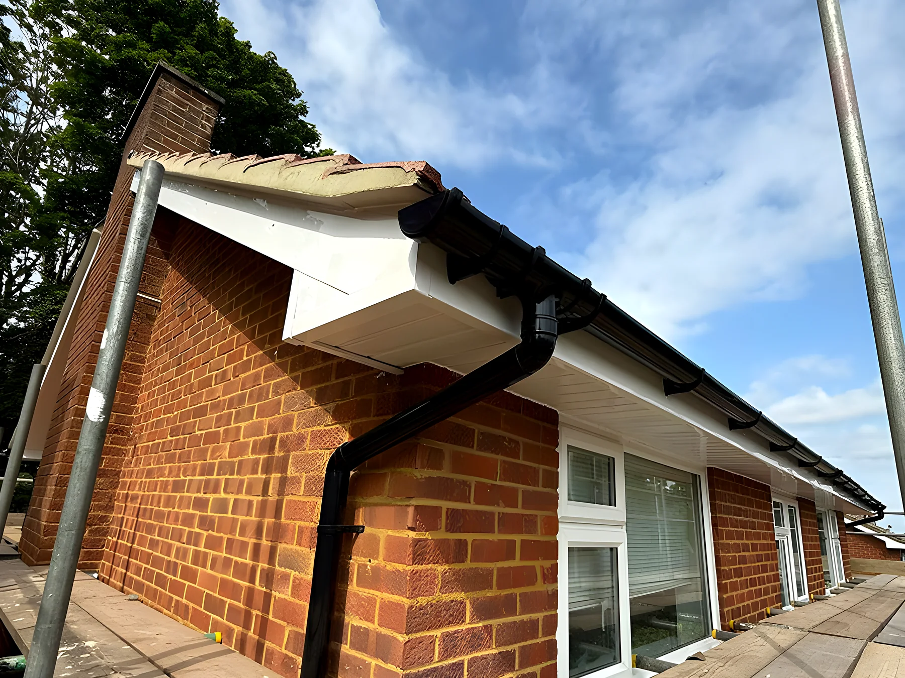 A brick house with new soffits and guttering
