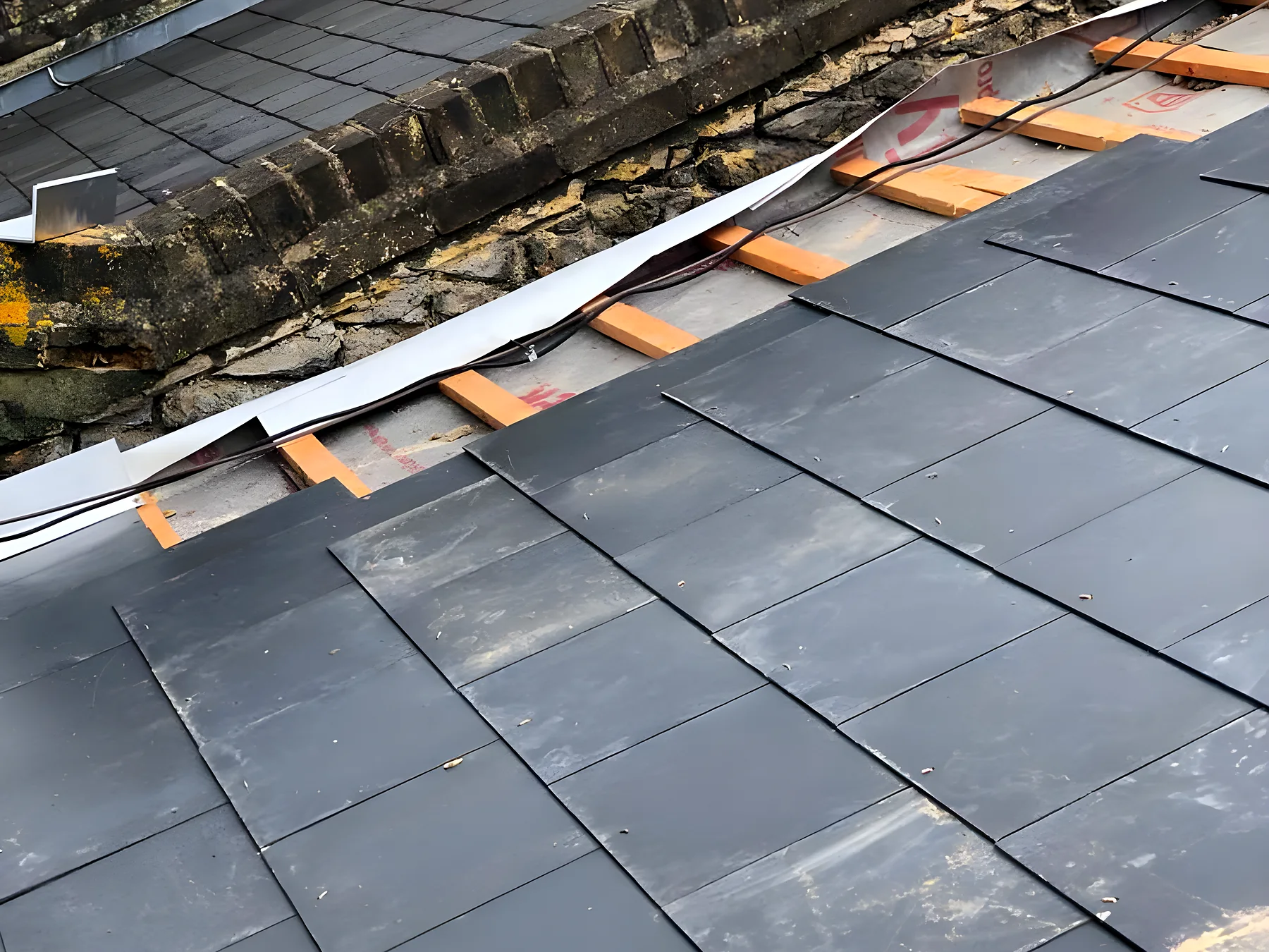 A slate roof stripped back to the battens