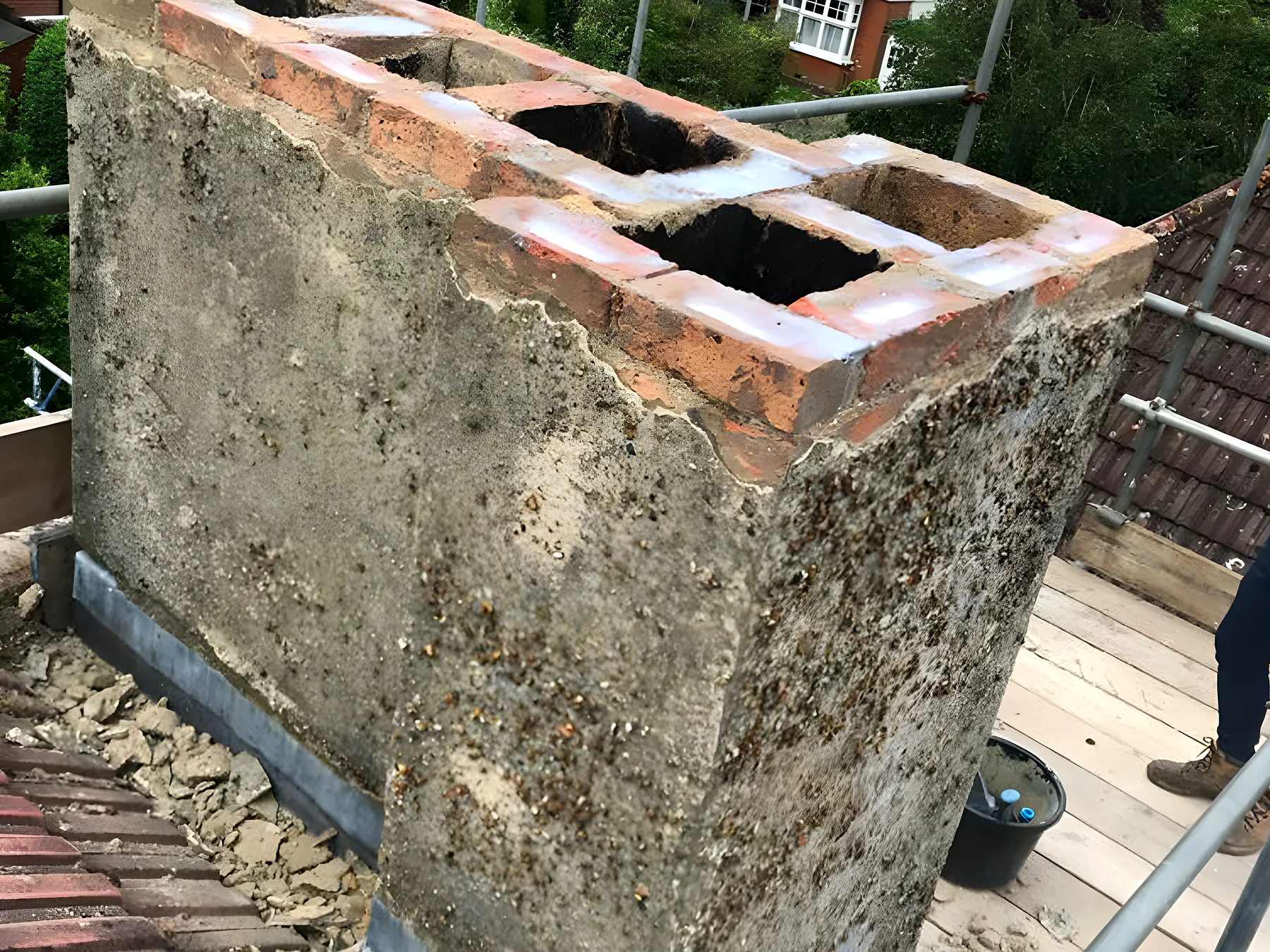 Weathered chimney stack before repointing