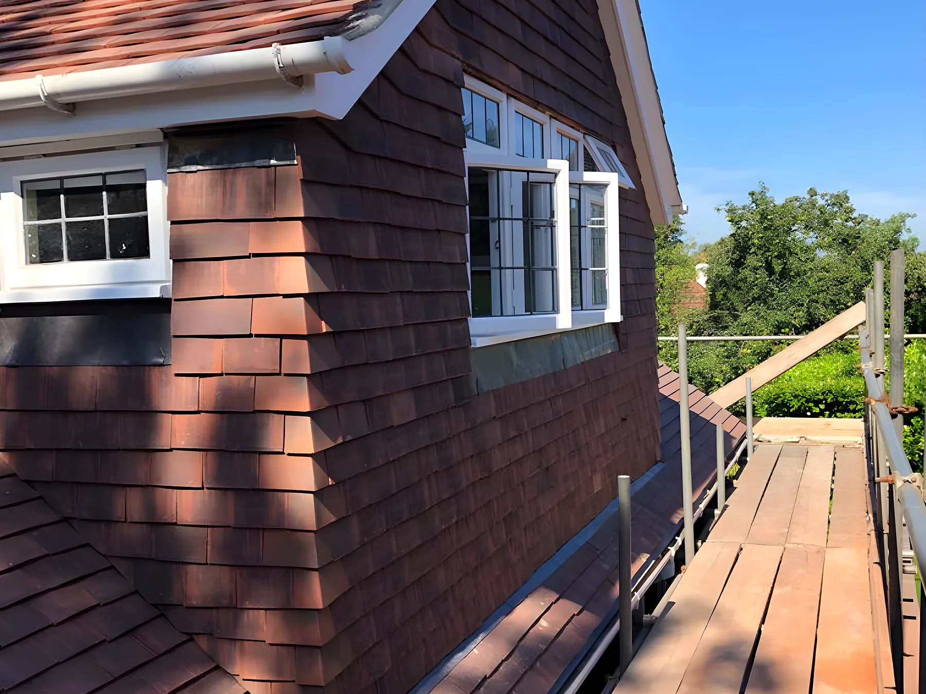 Timber clad dormer finished with clay tiles