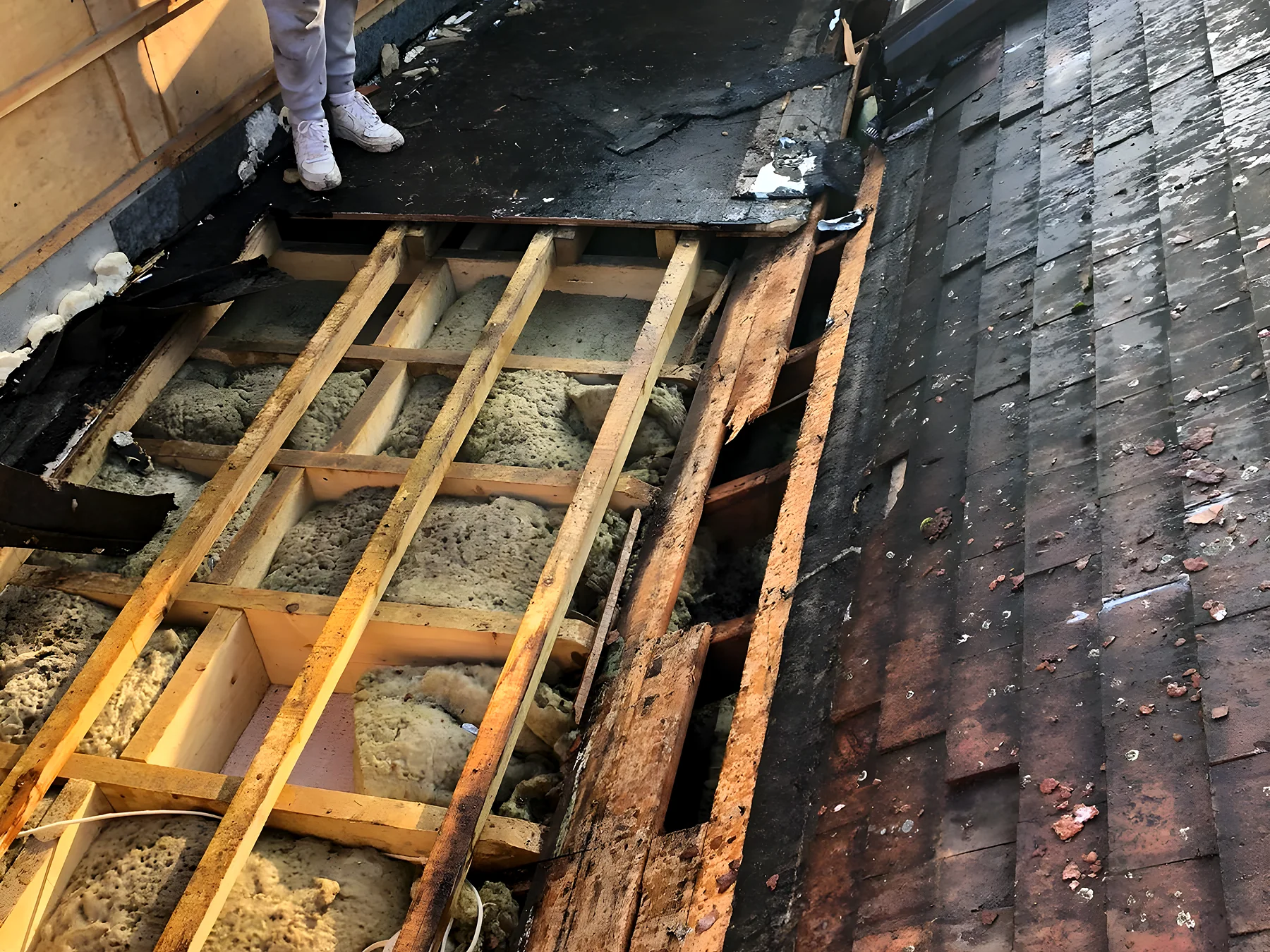 Old felt stripped from a flat roof deck