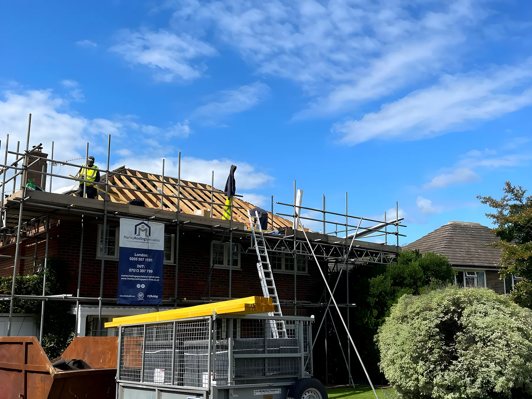 House with the scaffold up and the roof stripped back during an urgent repair